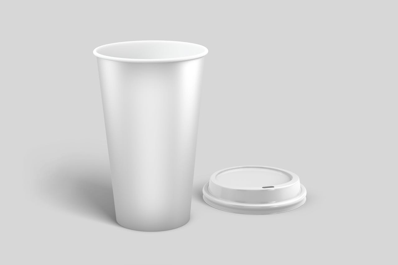 our-story A sleek minimalist design of a disposable coffee cup and lid, ideal for branding.